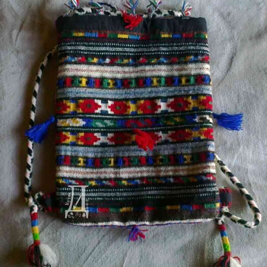 Larger ethno bag with tradiotional motifs, woven with wool - front.